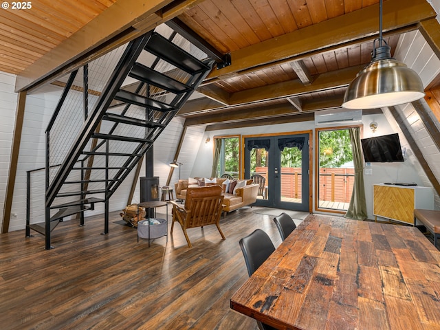 interior space featuring french doors, a wall mounted AC, beam ceiling, dark hardwood / wood-style flooring, and wood ceiling