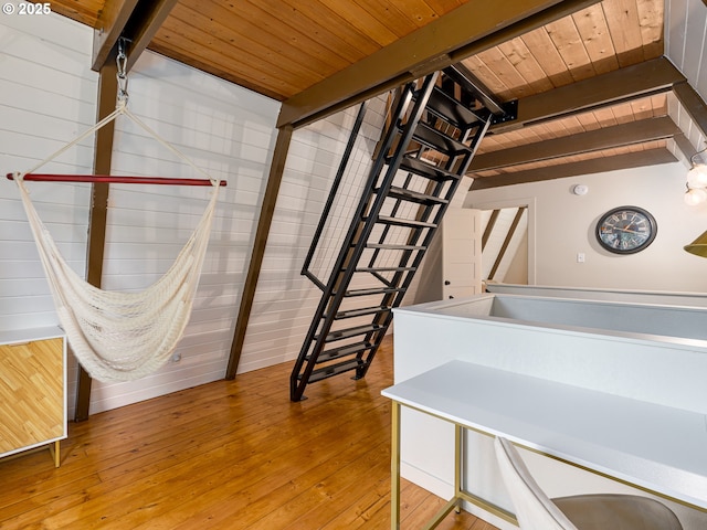 bathroom featuring beamed ceiling, hardwood / wood-style flooring, and wooden ceiling