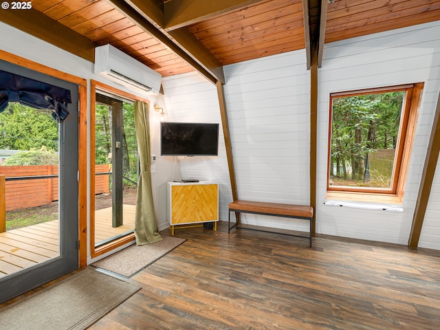 unfurnished sunroom with beam ceiling, a wall mounted AC, and wood ceiling