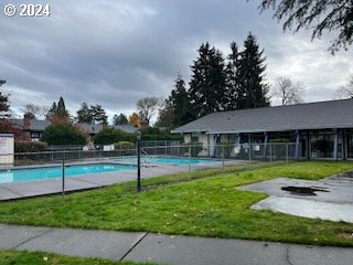 view of pool featuring a yard