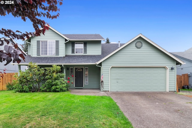 view of front of property with a garage, covered porch, and a front yard