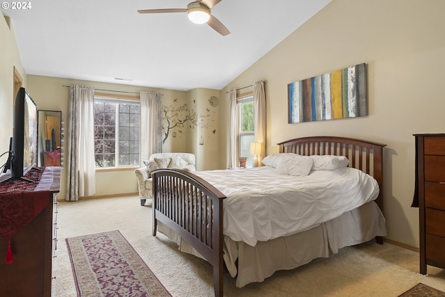 bedroom featuring lofted ceiling, light carpet, and ceiling fan