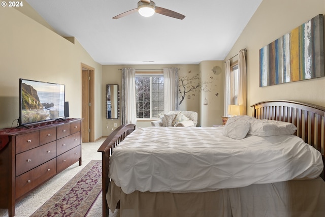 carpeted bedroom featuring lofted ceiling and ceiling fan