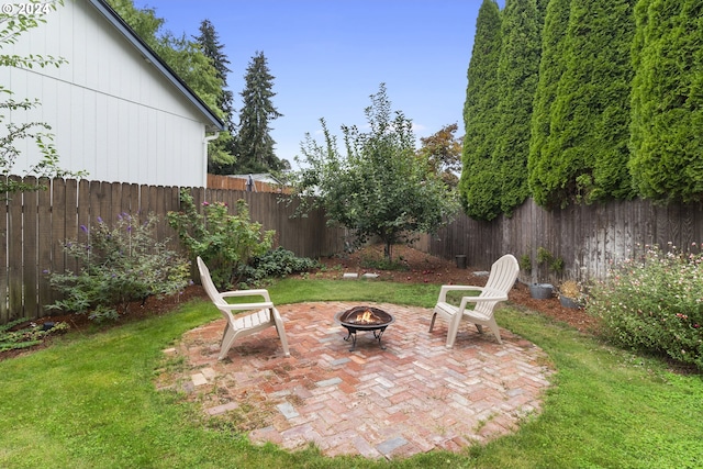 view of yard featuring a patio area and a fire pit