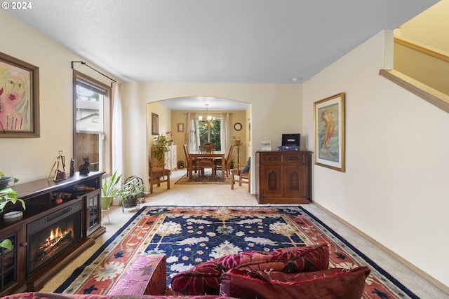 interior space with a chandelier and light colored carpet