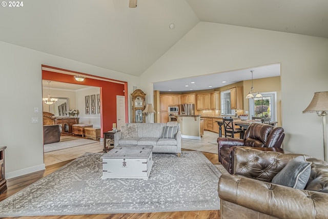 kitchen featuring decorative light fixtures, stainless steel appliances, a center island, and a wealth of natural light