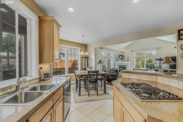 kitchen featuring light brown cabinetry, light tile patterned flooring, sink, and stainless steel appliances