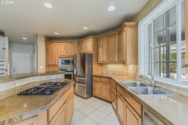 dining area with a notable chandelier, a wealth of natural light, light tile patterned flooring, and sink