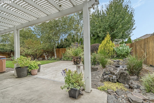 view of patio / terrace with a pergola and a hot tub