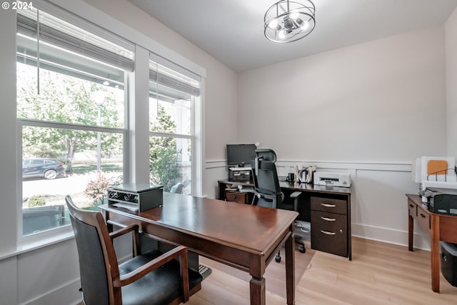 office with light wood-type flooring