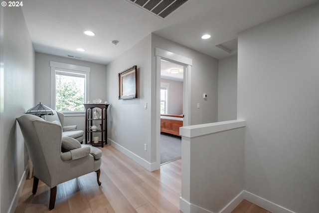 sitting room featuring light hardwood / wood-style flooring and a wealth of natural light