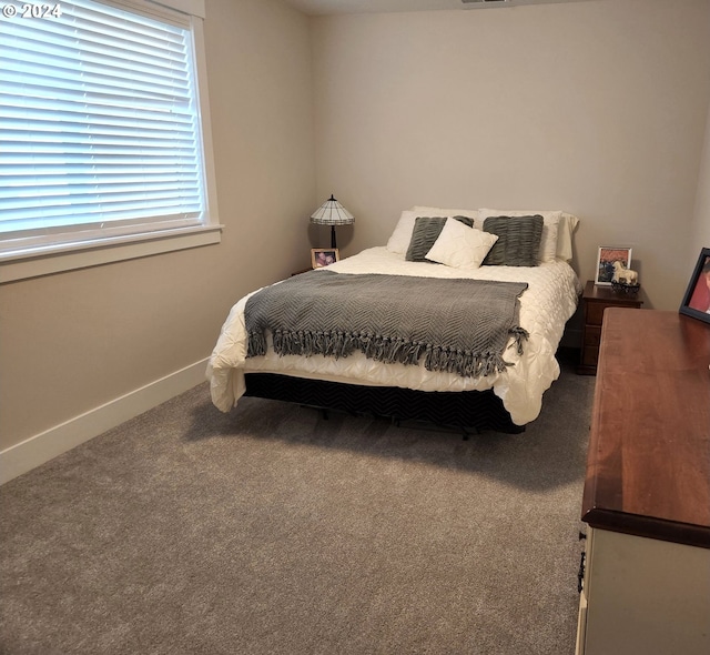 bedroom featuring carpet