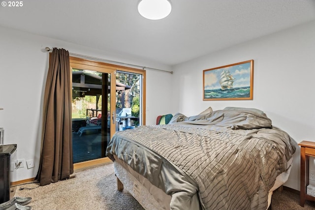 bedroom featuring carpet flooring and access to exterior