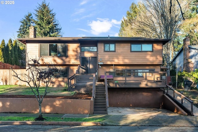 view of front of house featuring a wooden deck