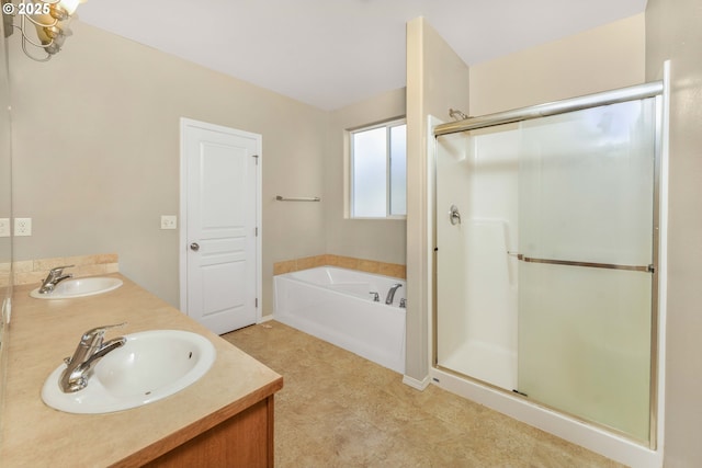 bathroom with a sink, a shower stall, and a bath