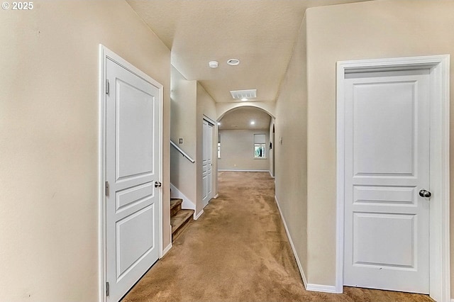 hallway with light carpet