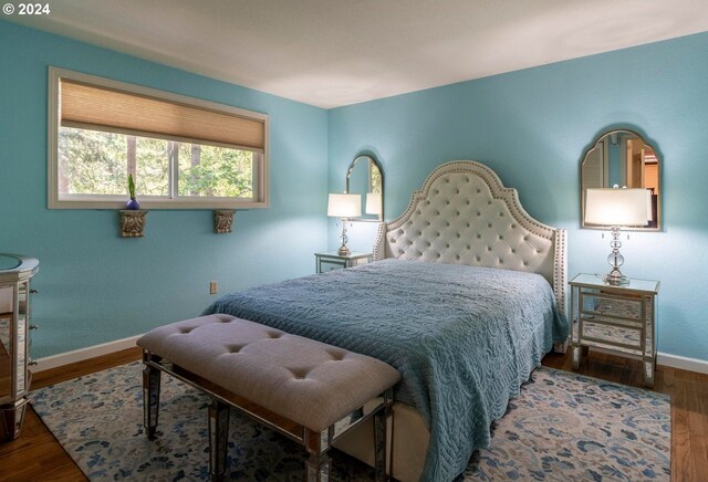 bedroom featuring dark hardwood / wood-style flooring