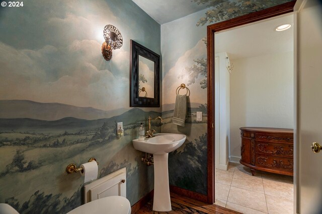 bathroom featuring toilet and tile patterned floors