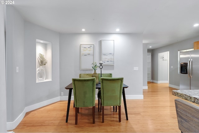 dining space featuring light hardwood / wood-style floors