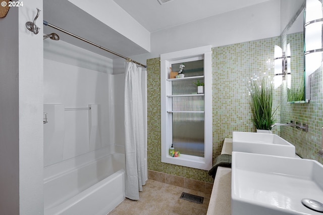 bathroom featuring shower / bath combo, tile patterned floors, and vanity