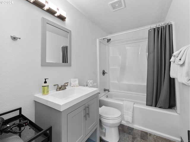 full bathroom with shower / bath combination with curtain, toilet, a textured ceiling, and vanity