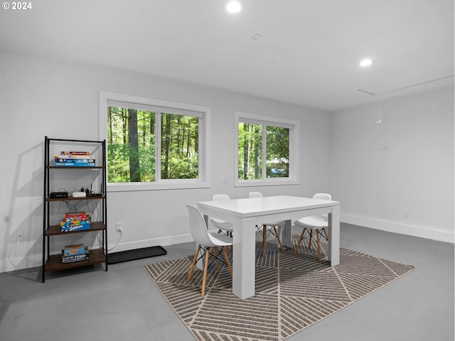 dining area with concrete flooring