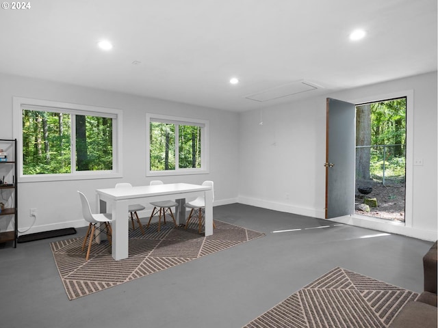 unfurnished dining area with concrete floors