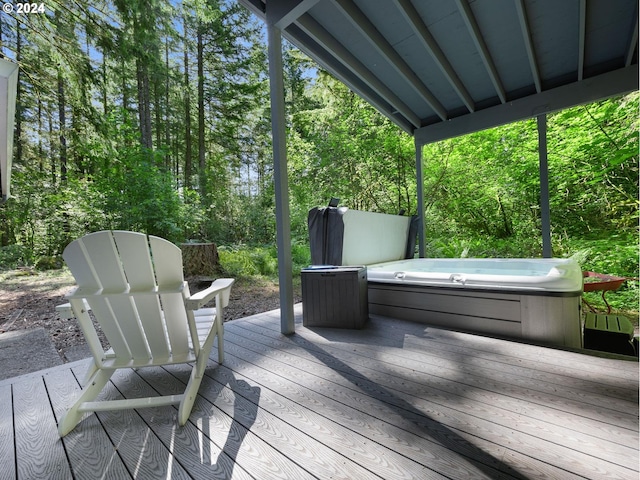 wooden terrace featuring a hot tub