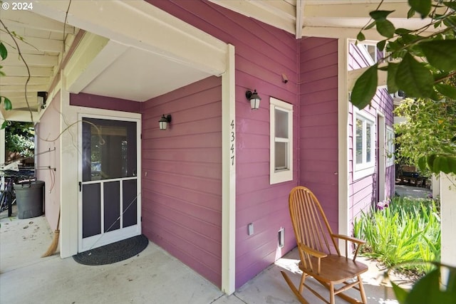 entrance to property with a patio