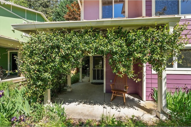 doorway to property featuring a patio area