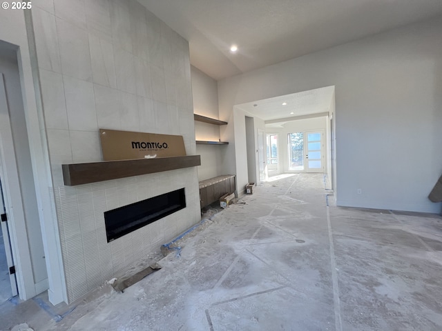 living room featuring a large fireplace