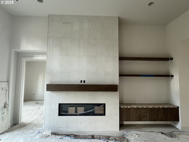 unfurnished living room featuring a fireplace