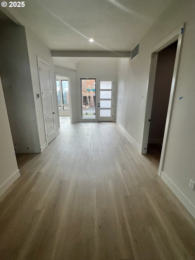 unfurnished living room featuring a large fireplace