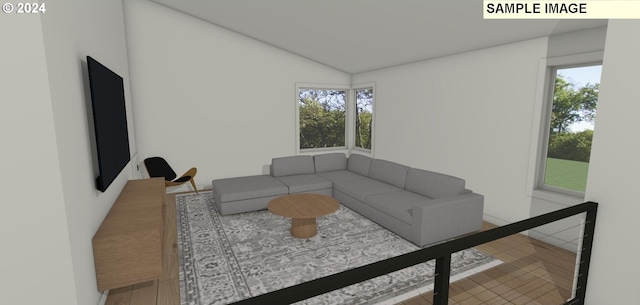 living room with vaulted ceiling and a healthy amount of sunlight