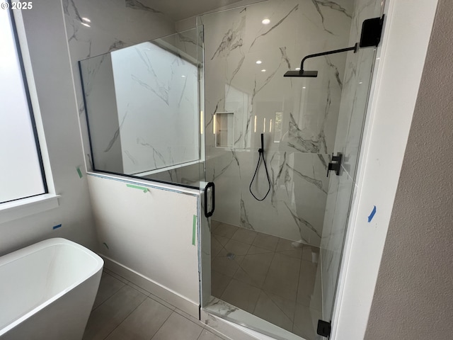 bathroom featuring shower with separate bathtub