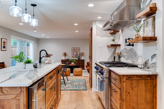 kitchen with open shelves, brown cabinetry, high end range, and wall chimney range hood