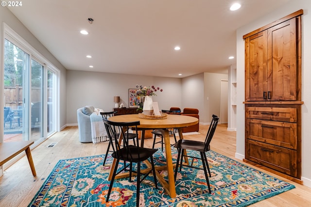 dining area featuring recessed lighting, visible vents, light wood finished floors, and baseboards