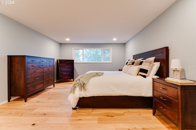 bedroom with recessed lighting, baseboards, and light wood finished floors