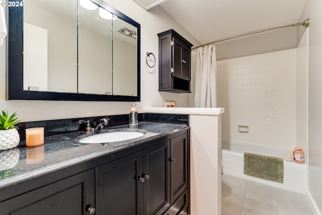 full bath with tile patterned floors, vanity, and shower / tub combo with curtain