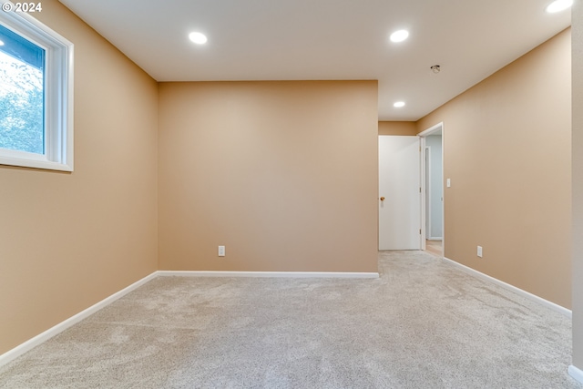 empty room with recessed lighting, carpet, and baseboards