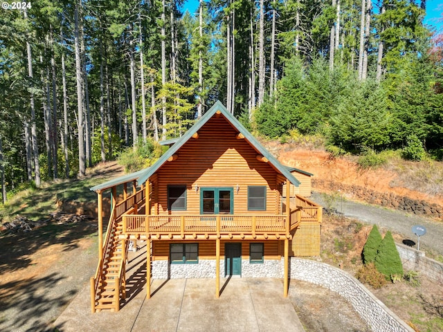 23835 Greasy Creek Rd, Philomath, OR 97370 - log home featuring a patio, a deck, stairway, log exterior, and a forest view