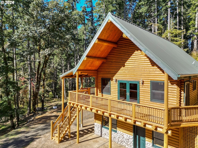 23835 Greasy Creek Rd, Philomath, OR 97370 - exterior space featuring log siding, a deck, metal roof, and stairway