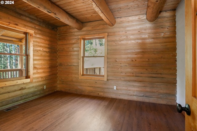 23835 Greasy Creek Rd, Philomath, OR 97370 - empty room with wooden ceiling with exposed beams, rustic walls, wood finished floors, and plenty of natural light