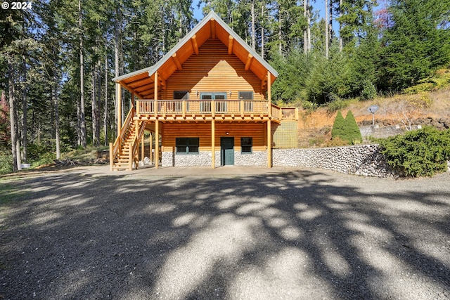 23835 Greasy Creek Rd, Philomath, OR 97370 - view of front of home with stairs, a wooden deck, and stone siding