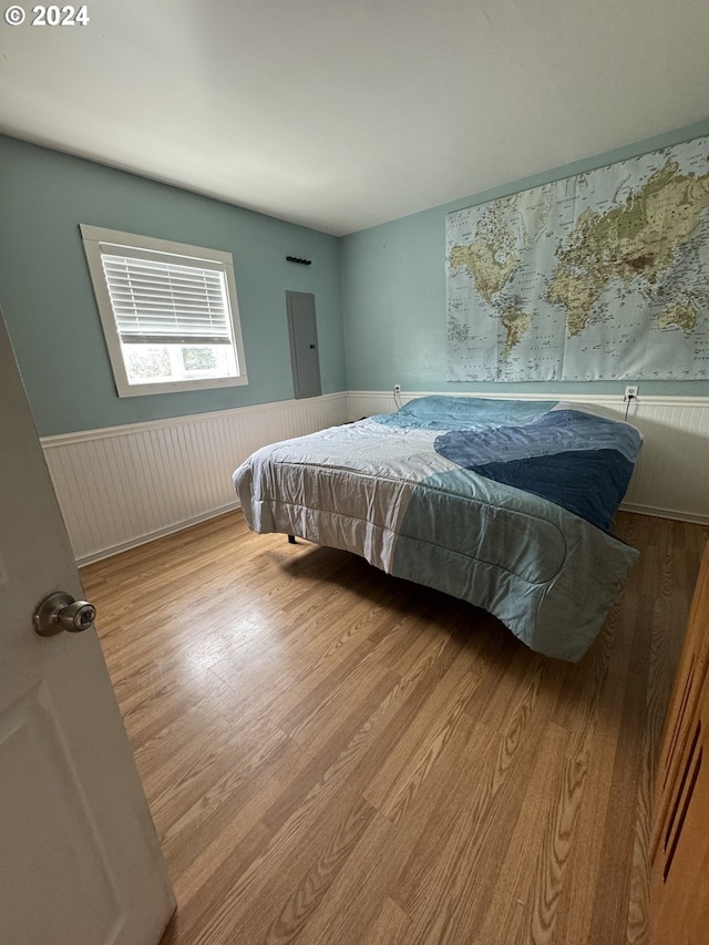 bedroom with hardwood / wood-style floors