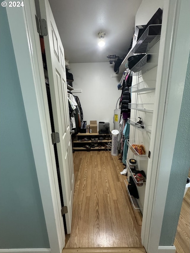 spacious closet with light hardwood / wood-style floors