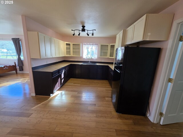 bathroom featuring hardwood / wood-style flooring, vaulted ceiling, vanity, and toilet