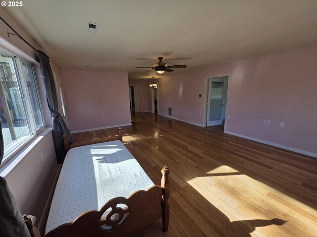 bathroom with toilet, hardwood / wood-style flooring, and vanity