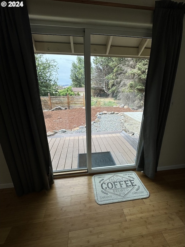 doorway to outside with hardwood / wood-style floors