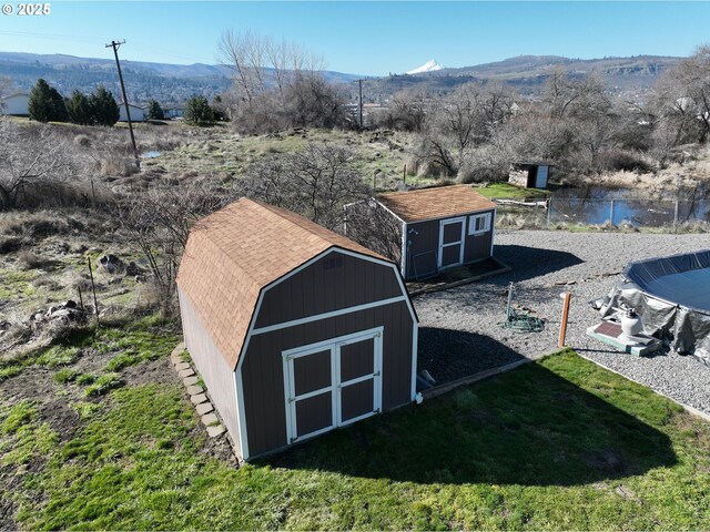 rear view of house with a yard and a deck